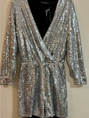 Lucky & Blessed L&B, is a Texas-based manufacturer Silver Sequin Surplice Romper